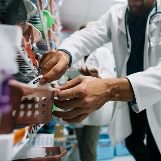 Doctor-finding-a-medicine-in-hospital-pharmacy